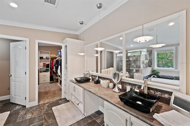 bathroom featuring walk in shower, vanity, and ornamental molding