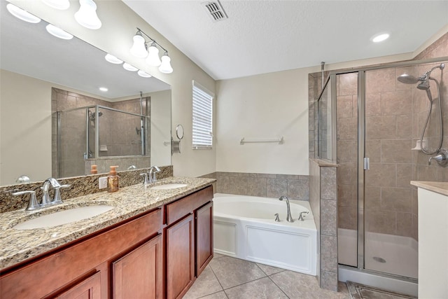 bathroom with vanity, tile patterned floors, and separate shower and tub