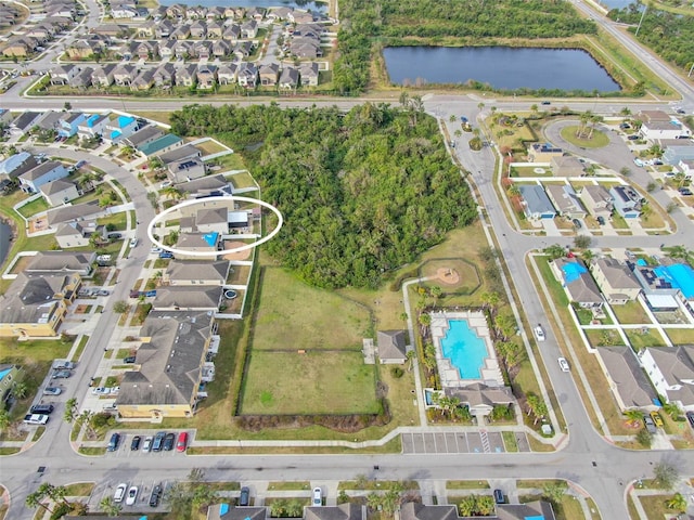 birds eye view of property featuring a water view