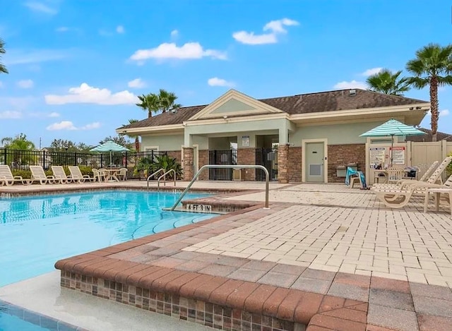 view of swimming pool with a patio area