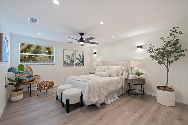 bedroom with light wood finished floors, recessed lighting, visible vents, a ceiling fan, and baseboards