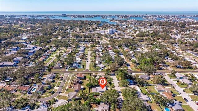 drone / aerial view featuring a water view and a residential view