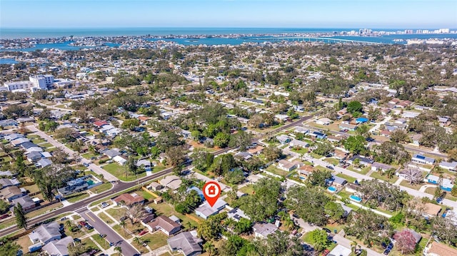 drone / aerial view featuring a water view and a residential view