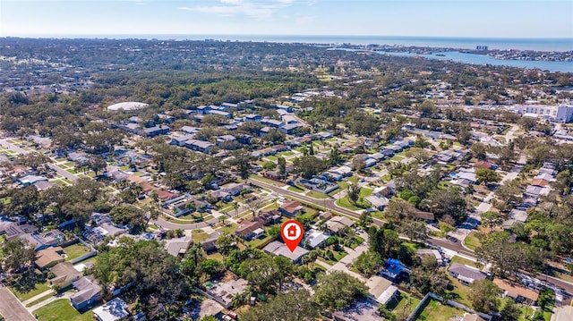 birds eye view of property with a water view and a residential view