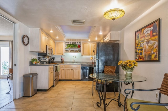 kitchen featuring black appliances, light brown cabinetry, sink, ornamental molding, and a tray ceiling