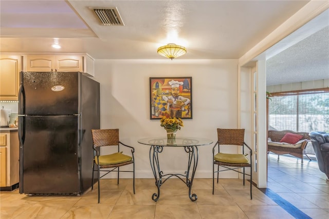 dining area with light tile patterned floors