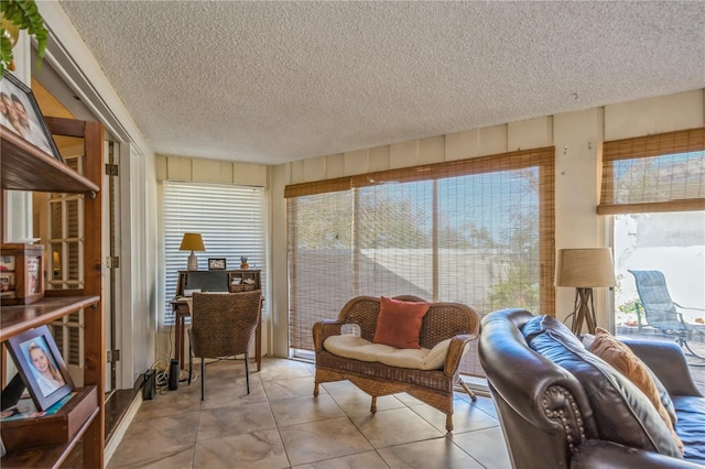 sitting room featuring a textured ceiling