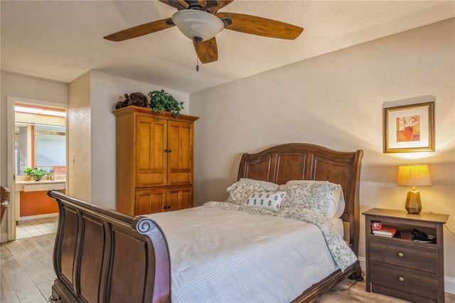 bedroom featuring ceiling fan, a textured ceiling, and light hardwood / wood-style flooring