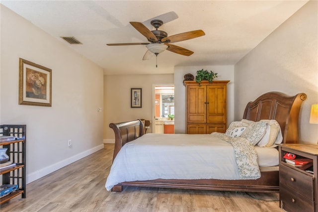 bedroom with ceiling fan and light hardwood / wood-style floors