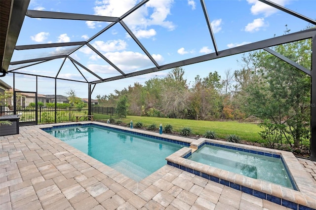 view of swimming pool with a lanai, a lawn, a patio, and an in ground hot tub