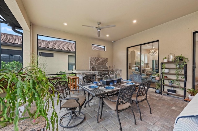 view of patio / terrace with area for grilling and ceiling fan