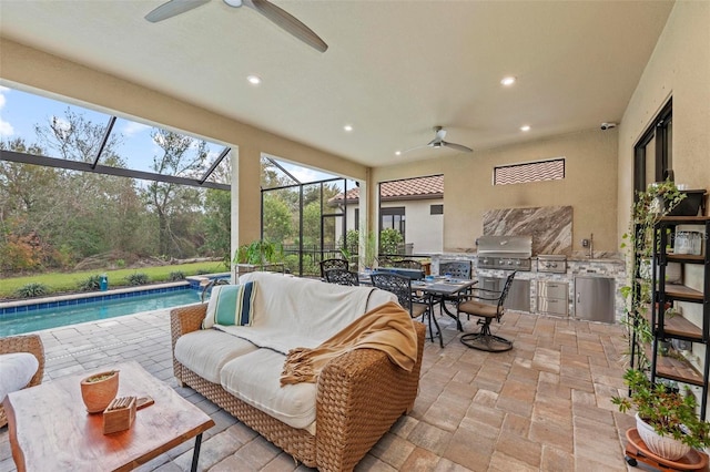 sunroom / solarium featuring ceiling fan