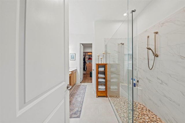 bathroom with vanity and a shower with shower door