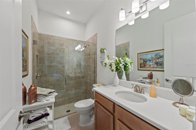 bathroom featuring vanity, tile patterned flooring, toilet, and walk in shower