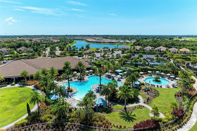 birds eye view of property with a water view