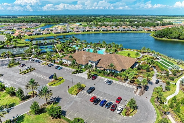 birds eye view of property with a water view