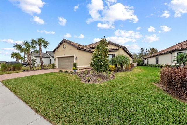 view of front of property featuring a garage and a front yard