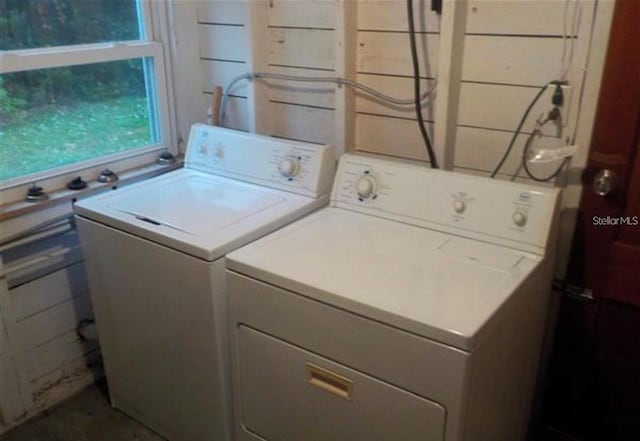 washroom with washing machine and clothes dryer