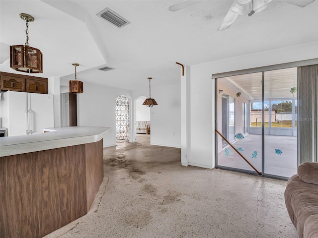 unfurnished living room with ceiling fan