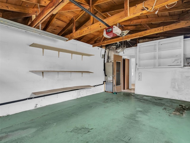 garage featuring wood ceiling and a garage door opener