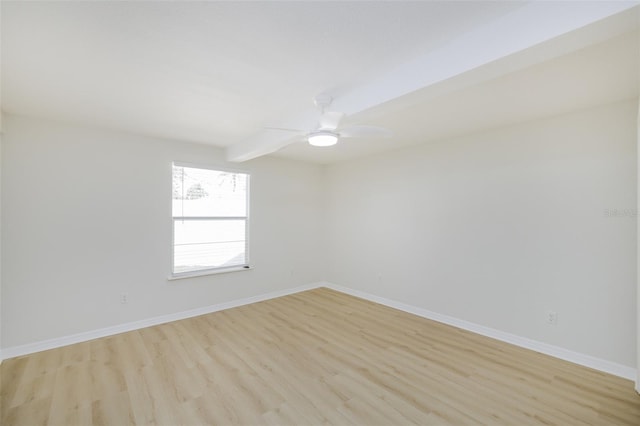 unfurnished room featuring beam ceiling, light wood-type flooring, and ceiling fan