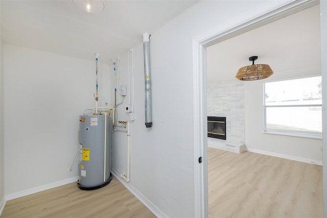 utility room with electric water heater