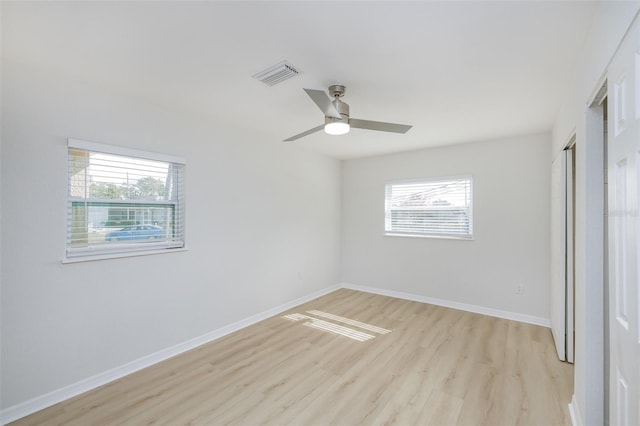 unfurnished bedroom with ceiling fan and light hardwood / wood-style flooring