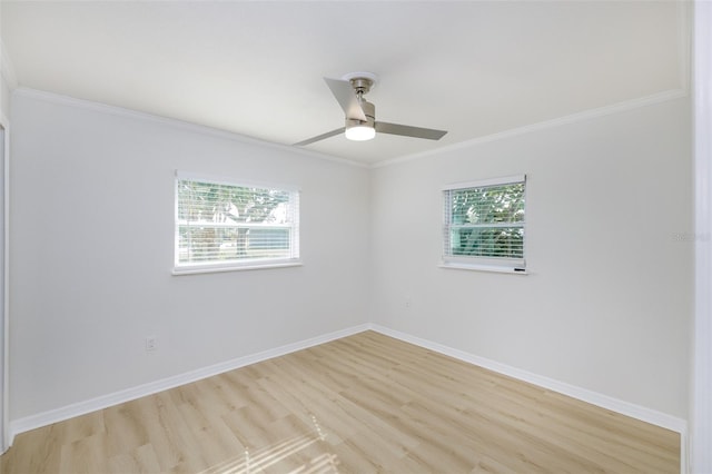 spare room featuring ceiling fan, crown molding, and light hardwood / wood-style floors