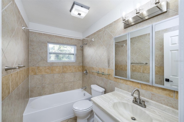 full bathroom with tiled shower / bath combo, vanity, tasteful backsplash, tile walls, and toilet