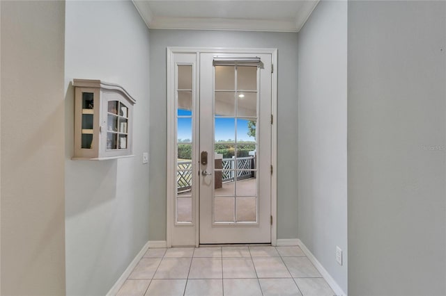 doorway with crown molding and light tile patterned floors