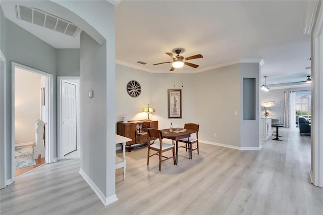 dining room featuring ceiling fan, light hardwood / wood-style flooring, and crown molding