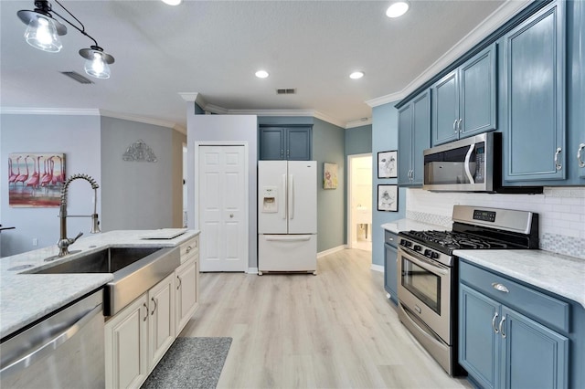 kitchen with crown molding, tasteful backsplash, blue cabinets, sink, and stainless steel appliances