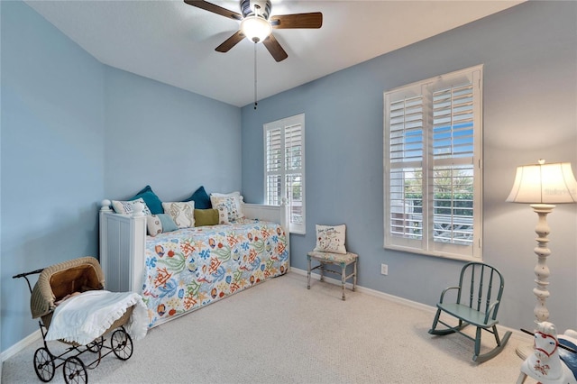 carpeted bedroom with ceiling fan