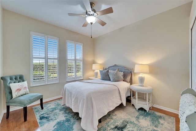 bedroom featuring ceiling fan and wood-type flooring