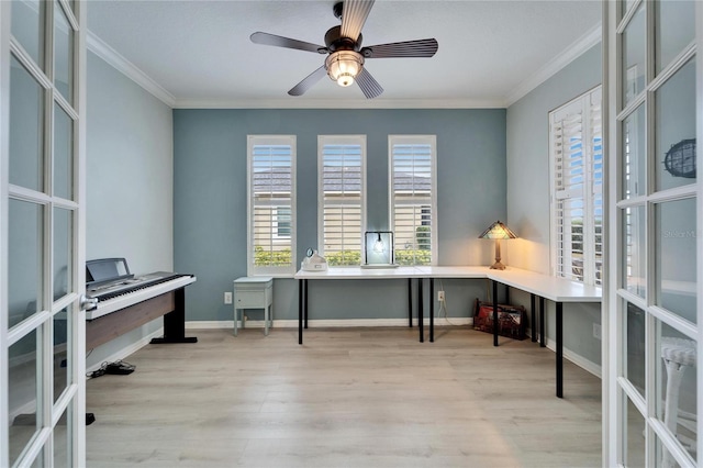 office area featuring ceiling fan, light hardwood / wood-style flooring, ornamental molding, and french doors