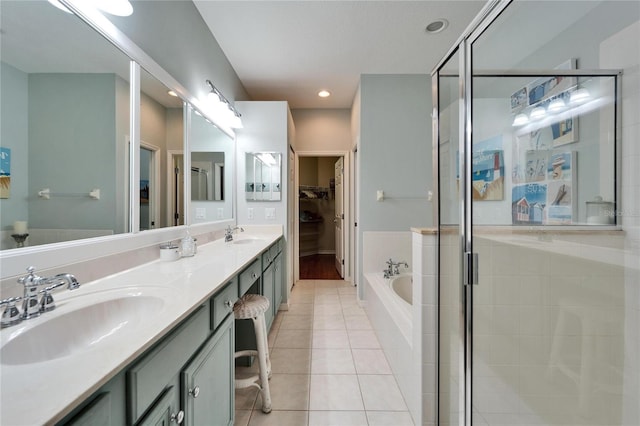 bathroom with tile patterned floors, vanity, and plus walk in shower