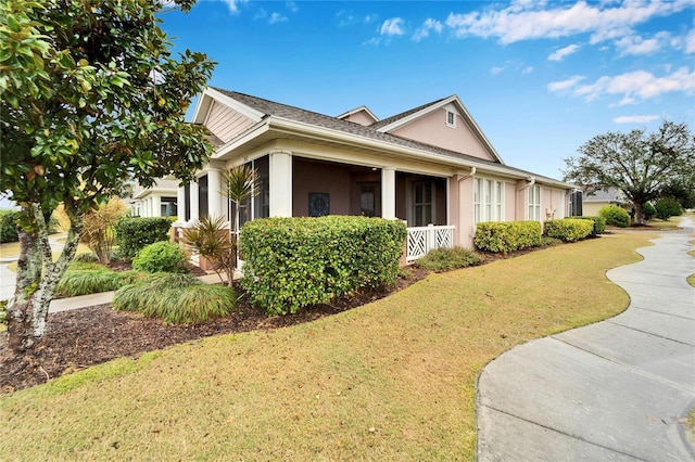 view of home's exterior with a lawn