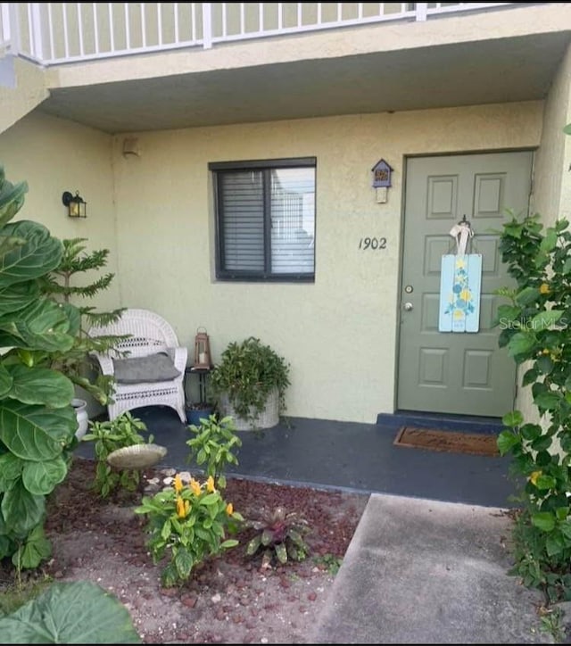 entrance to property with a balcony