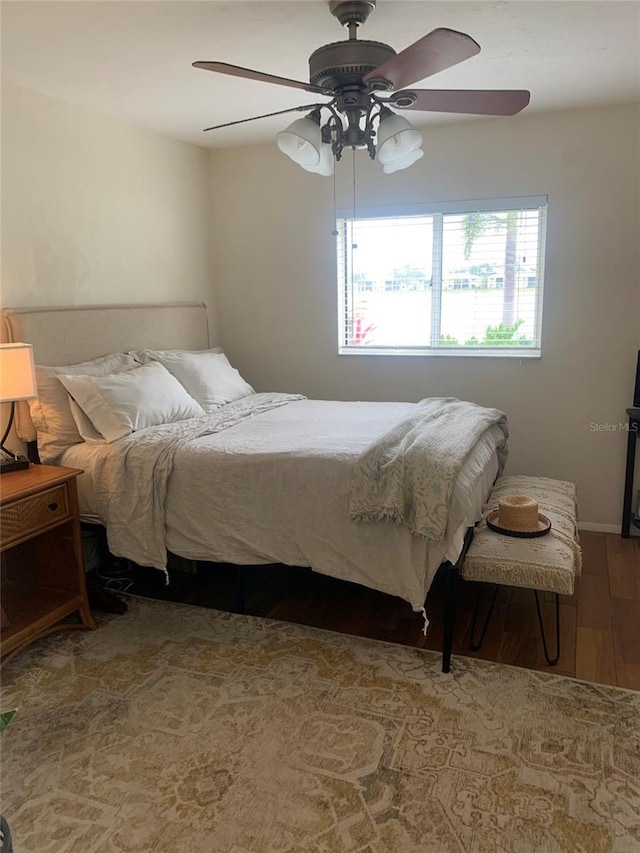 bedroom featuring ceiling fan and wood-type flooring