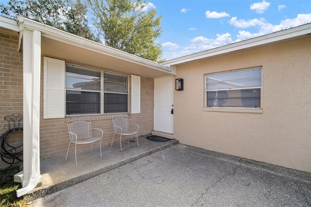 property entrance with a patio