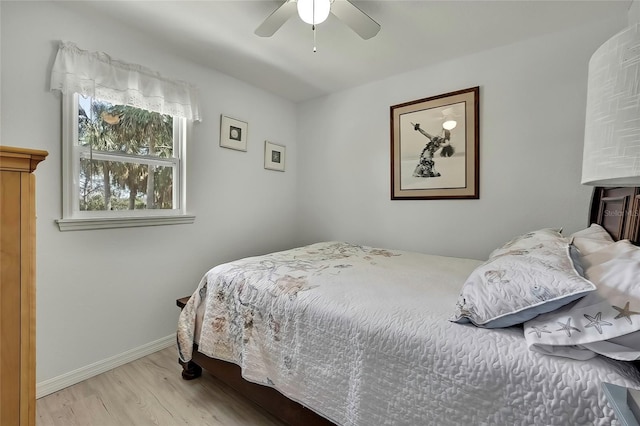 bedroom with light wood-type flooring and ceiling fan