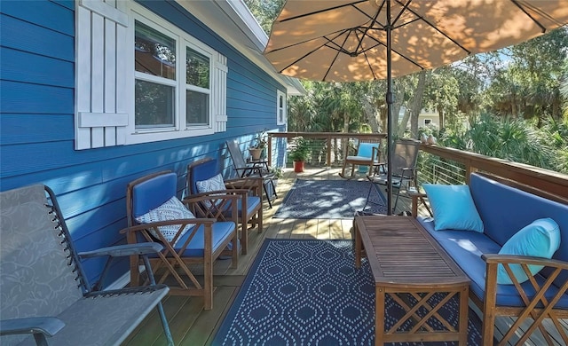 wooden terrace featuring an outdoor hangout area