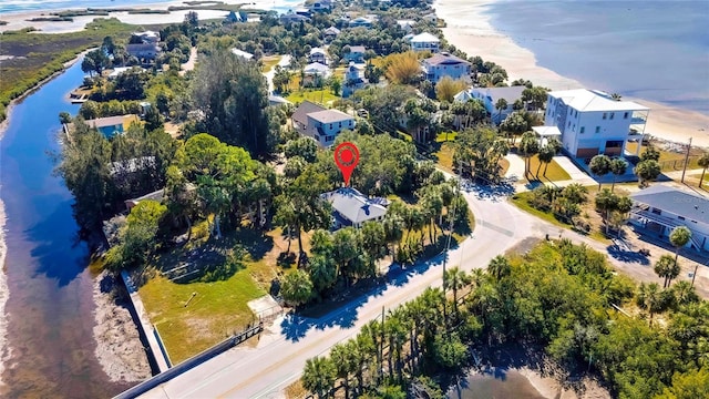 bird's eye view with a water view and a view of the beach