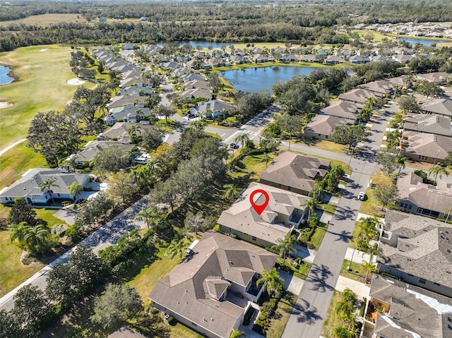 drone / aerial view featuring a residential view and a water view