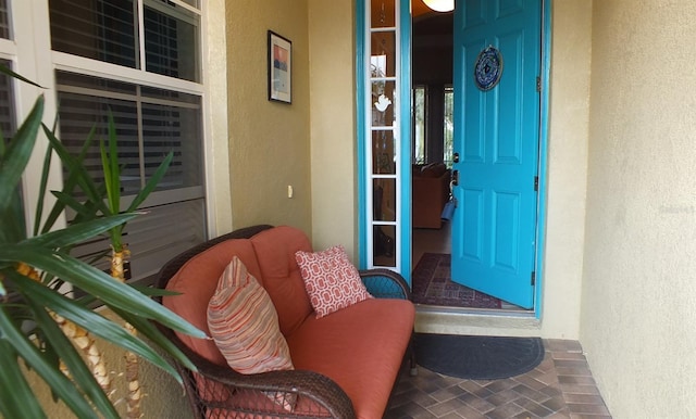 view of exterior entry featuring stucco siding