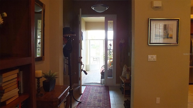 entryway featuring light tile patterned flooring