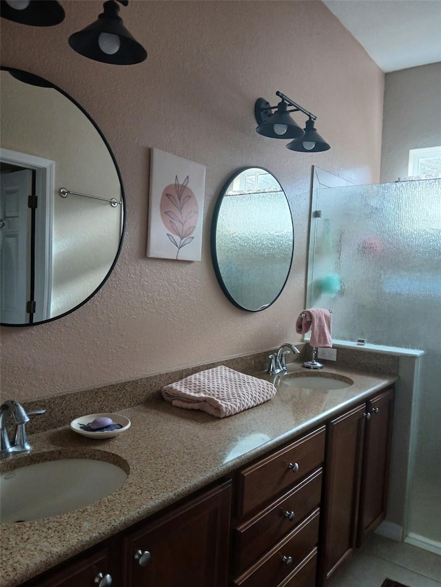 bathroom featuring double vanity and a sink