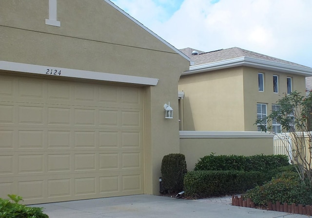 garage with concrete driveway