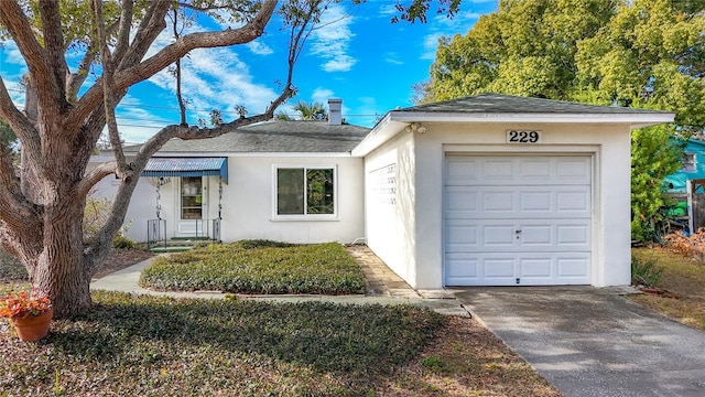 ranch-style home featuring a garage