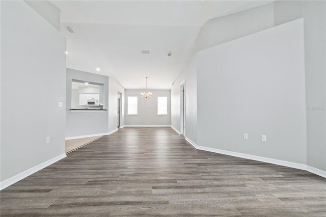 interior space featuring a chandelier and hardwood / wood-style flooring